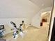 Carpeted attic room with an exercise bike at 170 White Rd, Fayetteville, GA 30214
