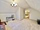 Attic area featuring carpet, window, and furniture at 170 White Rd, Fayetteville, GA 30214