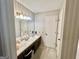 Bathroom featuring a marble vanity and striped wallpaper at 170 White Rd, Fayetteville, GA 30214
