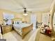 Bright bedroom with neutral walls, ceiling fan, and a cozy queen bed at 170 White Rd, Fayetteville, GA 30214