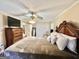 Bedroom featuring neutral walls, ceiling fan, and traditional furnishings at 170 White Rd, Fayetteville, GA 30214