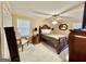Bedroom featuring neutral walls, ceiling fan, and traditional furnishings at 170 White Rd, Fayetteville, GA 30214