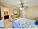 Bright bedroom featuring a queen bed, dresser, and connecting bathroom access at 170 White Rd, Fayetteville, GA 30214