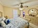 Bedroom with a ceiling fan, a queen bed, and natural light from a window at 170 White Rd, Fayetteville, GA 30214