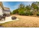 Expansive backyard with a patio seating area, perfect for outdoor entertaining and relaxation at 305 Roundwood Way, Peachtree City, GA 30269