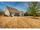 Large backyard featuring a patio, ideal for outdoor gatherings and enjoying the natural surroundings at 305 Roundwood Way, Peachtree City, GA 30269