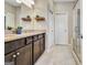 Bathroom with granite countertops, double vanity and dark wood cabinets at 305 Roundwood Way, Peachtree City, GA 30269
