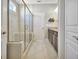 Bathroom with granite countertops, double vanity and a glass shower at 305 Roundwood Way, Peachtree City, GA 30269