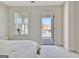 This bedroom offers a balcony, providing outdoor access for fresh air and natural light at 305 Roundwood Way, Peachtree City, GA 30269