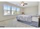 Sunlit bedroom with large windows offering neighborhood views, creating a bright and inviting atmosphere at 305 Roundwood Way, Peachtree City, GA 30269