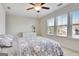 Bright, well-lit bedroom offers ample natural light, enhancing comfort and appeal with furniture at 305 Roundwood Way, Peachtree City, GA 30269