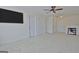 Bonus room featuring a mounted TV, carpet, and access to other rooms at 305 Roundwood Way, Peachtree City, GA 30269