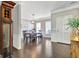 Dining room adjacent with elegant lighting and neutral tones at 305 Roundwood Way, Peachtree City, GA 30269