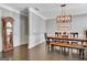 Dining room features a farmhouse table and wainscotting at 305 Roundwood Way, Peachtree City, GA 30269