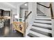 Entryway featuring a staircase, hardwood floors and stylish decor at 305 Roundwood Way, Peachtree City, GA 30269