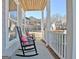 Inviting front porch with rocking chairs for relaxing at 305 Roundwood Way, Peachtree City, GA 30269
