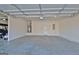 Bright and clean three-car garage interior showcasing ample space at 305 Roundwood Way, Peachtree City, GA 30269