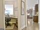 Hallway view of the office and kitchen with ample cabinet space and stainless appliances at 305 Roundwood Way, Peachtree City, GA 30269