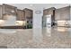 Granite kitchen countertops featuring built-in stainless appliances, cabinetry, and natural lighting at 305 Roundwood Way, Peachtree City, GA 30269