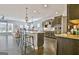 Spacious kitchen featuring a center island, modern cabinets, and stainless steel appliances at 305 Roundwood Way, Peachtree City, GA 30269