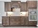 Gourmet kitchen featuring stainless steel appliances, granite countertops, and dark wood cabinets at 305 Roundwood Way, Peachtree City, GA 30269
