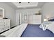 Comfortable main bedroom with tray ceiling, dark floors, and white dressers at 305 Roundwood Way, Peachtree City, GA 30269