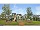 Community playground featuring modern play structures and equipment, set in a landscaped area at 305 Roundwood Way, Peachtree City, GA 30269