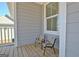 Cozy porch setting with chairs, creating an inviting space for relaxation and casual conversation at 305 Roundwood Way, Peachtree City, GA 30269