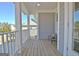 Enjoy the outdoors on this covered porch, ideal for lounging and taking in the tranquil surroundings at 305 Roundwood Way, Peachtree City, GA 30269