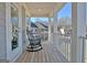 Relax on this charming porch with rocking chairs, perfect for enjoying quiet moments and neighborhood views at 305 Roundwood Way, Peachtree City, GA 30269