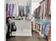 Walk-in closet with dark wood floors, clothing racks, and shelving at 305 Roundwood Way, Peachtree City, GA 30269
