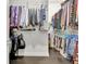 Spacious walk-in closet featuring organized shelving and hanging rods for ample storage at 305 Roundwood Way, Peachtree City, GA 30269