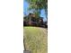 Charming brick home with a screened porch and mature trees. Front yard on a small hill at 586 Glen Iris Ne Dr, Atlanta, GA 30308