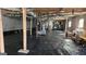 Unfinished basement, featuring concrete block walls and a black plastic moisture barrier at 3189 Fern Ridge Ne Dr, Conyers, GA 30013