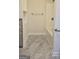 Bathroom featuring modern shower-tub combo with grey tile accent at 3189 Fern Ridge Ne Dr, Conyers, GA 30013