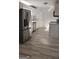 A kitchen featuring stainless steel appliances, modern cabinets, and wood-look floors at 3189 Fern Ridge Ne Dr, Conyers, GA 30013