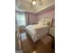Charming bedroom with an Eiffel Tower accent wall, filled with bright, natural light at 133 Ventura Trl, Stockbridge, GA 30281