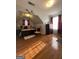 Cozy bedroom with hardwood floors, and a window with red curtains at 133 Ventura Trl, Stockbridge, GA 30281