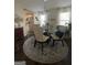 Elegant dining room with a glass table, chandelier, and coordinated decor at 133 Ventura Trl, Stockbridge, GA 30281