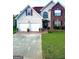 Charming two-story home with a well-manicured lawn, a two-car garage, and a welcoming entrance at 133 Ventura Trl, Stockbridge, GA 30281