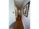 Hallway featuring hardwood floors and a picture hanging on the wall at 133 Ventura Trl, Stockbridge, GA 30281