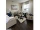 Cozy living room with stylish furnishings, a plush rug, and ample natural light at 133 Ventura Trl, Stockbridge, GA 30281