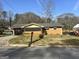 Charming brick home with mature trees and a sunny sky in a residential neighborhood at 2019 Se Thomasville Se Dr, Atlanta, GA 30315