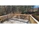 Wooden deck with a view of a wooded backyard, perfect for outdoor enjoyment at 194 Goldleaf Dr, Hampton, GA 30228