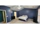 Bedroom featuring a white bed, ceiling fan, and window with blinds at 194 Goldleaf Dr, Hampton, GA 30228