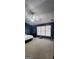Bedroom featuring a white bed, ceiling fan, and large window at 194 Goldleaf Dr, Hampton, GA 30228