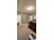 Empty bedroom showcasing tray ceiling, carpet floors and two closets at 194 Goldleaf Dr, Hampton, GA 30228