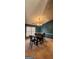 Traditional dining room featuring a wooden table, chairs, and a chandelier beneath a textured ceiling at 194 Goldleaf Dr, Hampton, GA 30228