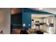 The living room features tan sofas and is adjacent to a kitchen with white cabinets and stainless appliances at 194 Goldleaf Dr, Hampton, GA 30228
