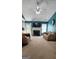 Living room with sofas, fireplace and mantel with tv at 194 Goldleaf Dr, Hampton, GA 30228